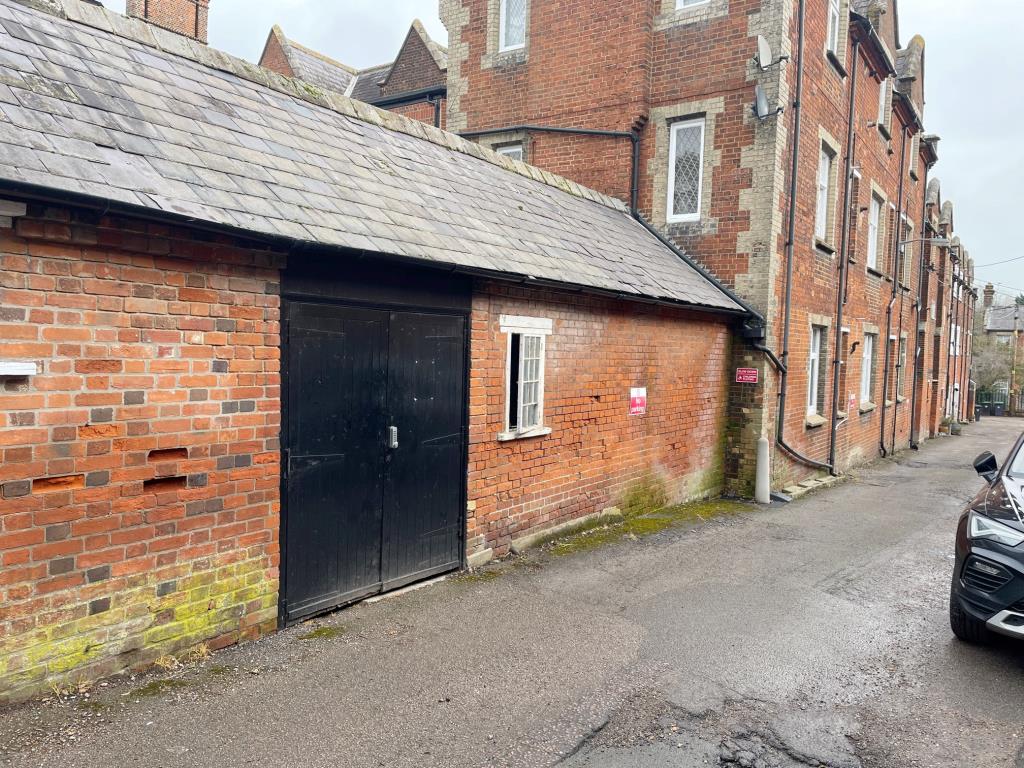 Lot: 75 - VACANT LOCK-UP STORE WITH POTENTIAL - Rear view of Vacant Lock-up Store/Studio in Gt Dunmow